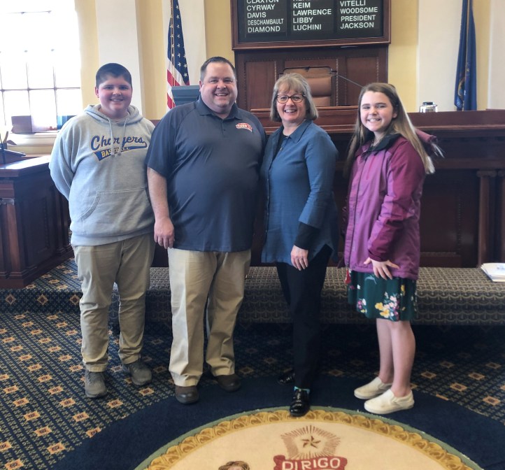 Guerin with the Simcox family.jpg